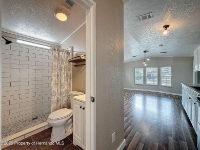 NO LOT RENT, it is a deeded lot, 2 bedrooms 1 Bath. A/C 2018 and on Glen Lakes Country Club in Florida - for sale on GolfHomes.com, golf home, golf lot