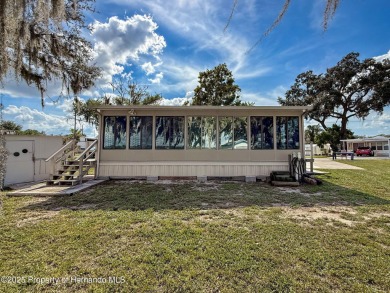 NO LOT RENT, it is a deeded lot, 2 bedrooms 1 Bath. A/C 2018 and on Glen Lakes Country Club in Florida - for sale on GolfHomes.com, golf home, golf lot
