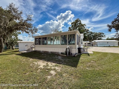 NO LOT RENT, it is a deeded lot, 2 bedrooms 1 Bath. A/C 2018 and on Glen Lakes Country Club in Florida - for sale on GolfHomes.com, golf home, golf lot