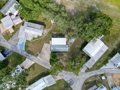 NO LOT RENT, it is a deeded lot, 2 bedrooms 1 Bath. A/C 2018 and on Glen Lakes Country Club in Florida - for sale on GolfHomes.com, golf home, golf lot