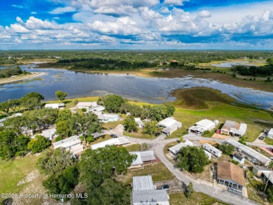 NO LOT RENT, it is a deeded lot, 2 bedrooms 1 Bath. A/C 2018 and on Glen Lakes Country Club in Florida - for sale on GolfHomes.com, golf home, golf lot