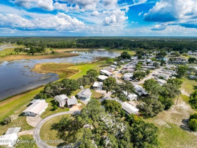 NO LOT RENT, it is a deeded lot, 2 bedrooms 1 Bath. A/C 2018 and on Glen Lakes Country Club in Florida - for sale on GolfHomes.com, golf home, golf lot