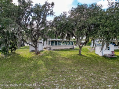 NO LOT RENT, it is a deeded lot, 2 bedrooms 1 Bath. A/C 2018 and on Glen Lakes Country Club in Florida - for sale on GolfHomes.com, golf home, golf lot