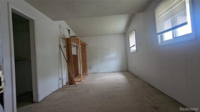 MOTIVATED SELLER! Three-bedroom, 2 full baths ranch. Located on The Links At Crystal Lake in Michigan - for sale on GolfHomes.com, golf home, golf lot