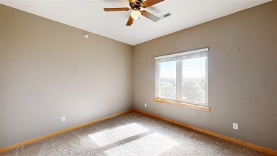Looking for a top floor condo with priceless views of woods on Blue Top Ridge At Riverside in Iowa - for sale on GolfHomes.com, golf home, golf lot
