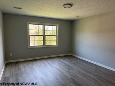 Fully renovated condo located in Cheat Lake, has beautiful LVP on Mountain View Golf Course in West Virginia - for sale on GolfHomes.com, golf home, golf lot