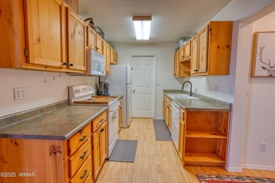 Don't miss this rare opportunity to own this lake view home! on Silver Creek Golf Club in Arizona - for sale on GolfHomes.com, golf home, golf lot