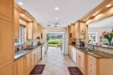 Beautiful villa with sweeping lake and golf course views on Quail Ridge Golf Course and Country Club in Florida - for sale on GolfHomes.com, golf home, golf lot