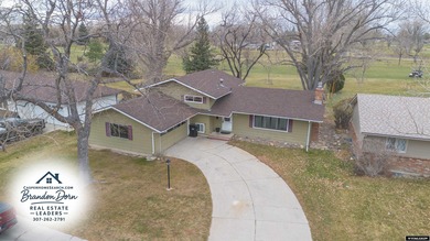 Welcome to this beautiful 3-bedroom, 2-bath tri-level located on on Paradise Valley Country Club in Wyoming - for sale on GolfHomes.com, golf home, golf lot