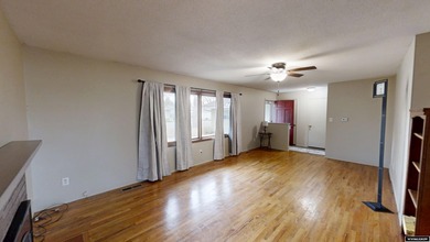 Welcome to this beautiful 3-bedroom, 2-bath tri-level located on on Paradise Valley Country Club in Wyoming - for sale on GolfHomes.com, golf home, golf lot