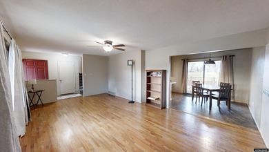 Welcome to this beautiful 3-bedroom, 2-bath tri-level located on on Paradise Valley Country Club in Wyoming - for sale on GolfHomes.com, golf home, golf lot