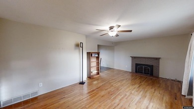 Welcome to this beautiful 3-bedroom, 2-bath tri-level located on on Paradise Valley Country Club in Wyoming - for sale on GolfHomes.com, golf home, golf lot