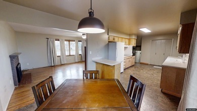 Welcome to this beautiful 3-bedroom, 2-bath tri-level located on on Paradise Valley Country Club in Wyoming - for sale on GolfHomes.com, golf home, golf lot