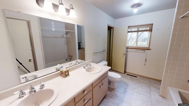 Welcome to this beautiful 3-bedroom, 2-bath tri-level located on on Paradise Valley Country Club in Wyoming - for sale on GolfHomes.com, golf home, golf lot