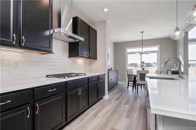 STUNNING HOME IN CHAMPIONS POINTE, LESS THAN ONE YEAR OLD! This on Champions Pointe Golf Course in Indiana - for sale on GolfHomes.com, golf home, golf lot