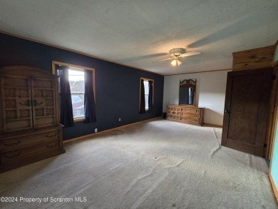 Check out this 3-bedroom, 1-bathroom log home! Featuring a cozy on Rock Creek Golf Course in Pennsylvania - for sale on GolfHomes.com, golf home, golf lot