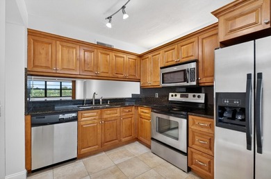 Enjoy top-floor living in this desirable fourth-floor corner on Bear Lakes Country Club in Florida - for sale on GolfHomes.com, golf home, golf lot