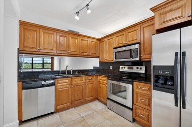 Enjoy top-floor living in this desirable fourth-floor corner on Bear Lakes Country Club in Florida - for sale on GolfHomes.com, golf home, golf lot