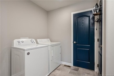 STUNNING HOME IN CHAMPIONS POINTE, LESS THAN ONE YEAR OLD! This on Champions Pointe Golf Course in Indiana - for sale on GolfHomes.com, golf home, golf lot