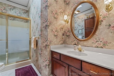 Discover serene golf course living in the prestigious gated on Carolina Trace Country Club in North Carolina - for sale on GolfHomes.com, golf home, golf lot