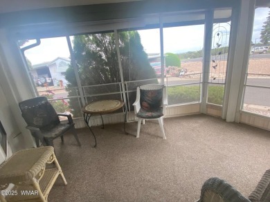 This spacious park model features lots of windows, a woodburning on Juniper Ridge R.V. Golf Resort in Arizona - for sale on GolfHomes.com, golf home, golf lot
