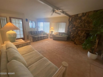 This spacious park model features lots of windows, a woodburning on Juniper Ridge R.V. Golf Resort in Arizona - for sale on GolfHomes.com, golf home, golf lot