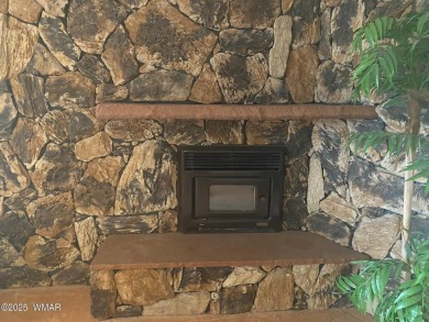 This spacious park model features lots of windows, a woodburning on Juniper Ridge R.V. Golf Resort in Arizona - for sale on GolfHomes.com, golf home, golf lot