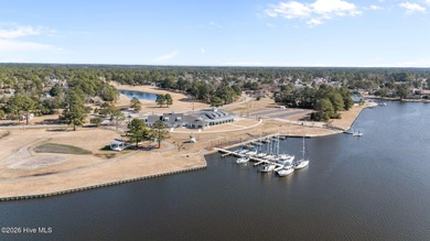 This well-maintained brick home sits on a spacious corner lot in on Harbour Point Golf Club in North Carolina - for sale on GolfHomes.com, golf home, golf lot