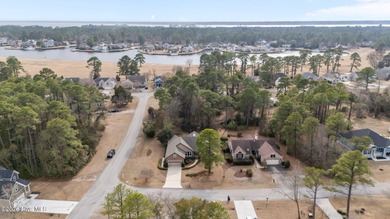 This well-maintained brick home sits on a spacious corner lot in on Harbour Point Golf Club in North Carolina - for sale on GolfHomes.com, golf home, golf lot