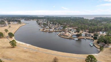 This well-maintained brick home sits on a spacious corner lot in on Harbour Point Golf Club in North Carolina - for sale on GolfHomes.com, golf home, golf lot