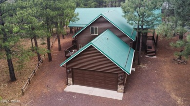 Experience comfort and privacy in this 5-bedroom, 6-bathroom on Pinetop Lakes Country Club in Arizona - for sale on GolfHomes.com, golf home, golf lot