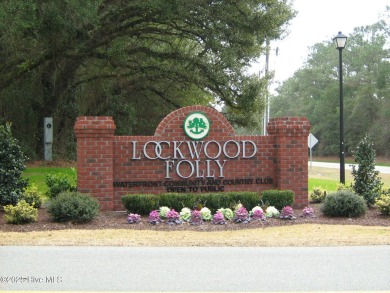 Lovely wooded lot along Fairway #3 in Lockwood Folly Country on Lockwood Folly Country Club in North Carolina - for sale on GolfHomes.com, golf home, golf lot