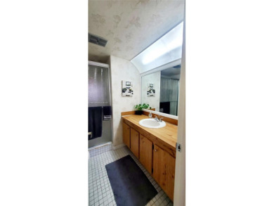MUST SEE! Beautifully UPDATED 3rd FLOOR 2/2 PENTHOUSE condo in on Sunrise Lakes Phase IV Golf Course in Florida - for sale on GolfHomes.com, golf home, golf lot