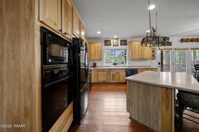 Experience comfort and privacy in this 5-bedroom, 6-bathroom on Pinetop Lakes Country Club in Arizona - for sale on GolfHomes.com, golf home, golf lot
