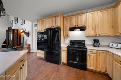 Experience comfort and privacy in this 5-bedroom, 6-bathroom on Pinetop Lakes Country Club in Arizona - for sale on GolfHomes.com, golf home, golf lot