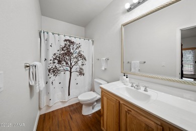 Experience comfort and privacy in this 5-bedroom, 6-bathroom on Pinetop Lakes Country Club in Arizona - for sale on GolfHomes.com, golf home, golf lot