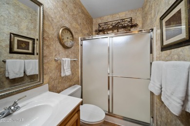 Experience comfort and privacy in this 5-bedroom, 6-bathroom on Pinetop Lakes Country Club in Arizona - for sale on GolfHomes.com, golf home, golf lot