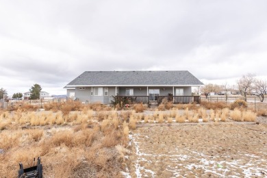 This charming home features 3 bedrooms and 2 bathrooms on Spring Creek Golf Course in Nevada - for sale on GolfHomes.com, golf home, golf lot