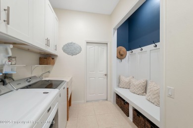 Tucked within the exclusive gated community of Silverthorn, this on Silverthorn Country Club in Florida - for sale on GolfHomes.com, golf home, golf lot