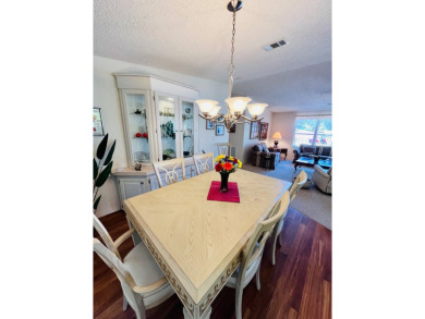 If you're looking for a beautifully maintained, move-in-ready on Pine Lakes Country Club in Florida - for sale on GolfHomes.com, golf home, golf lot