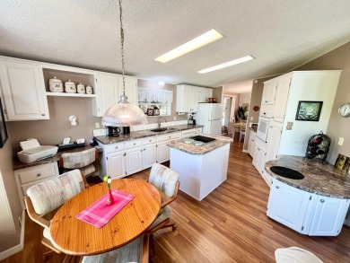 If you're looking for a beautifully maintained, move-in-ready on Pine Lakes Country Club in Florida - for sale on GolfHomes.com, golf home, golf lot
