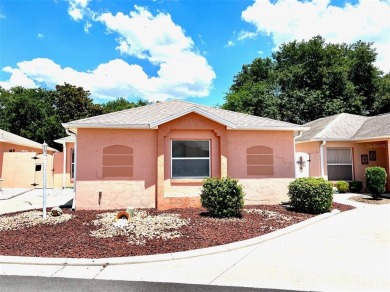 BOND PAID! This TURNKEY & MOVE IN READY, 2 BR/ 2 BA/ courtyard on De La Vista Executive Golf Course in Florida - for sale on GolfHomes.com, golf home, golf lot