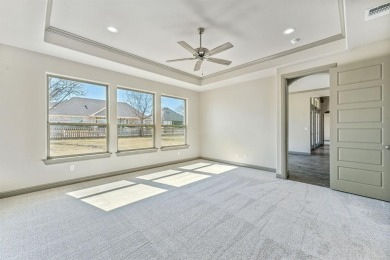 Open concept floor plan vaulted ceiling living room thru the on Nutcracker Golf Club in Texas - for sale on GolfHomes.com, golf home, golf lot
