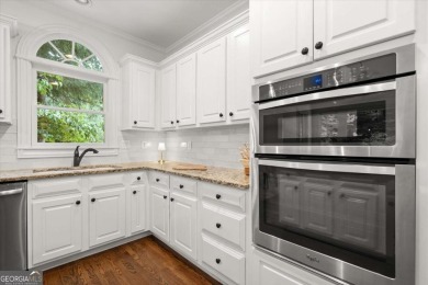 Experience resort-style living perfectly positioned on a private on Woodmont Golf and Country Club in Georgia - for sale on GolfHomes.com, golf home, golf lot