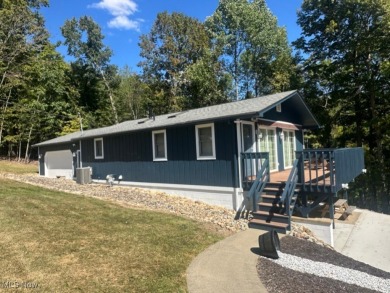 Welcome to this serene 3-bedroom, 2-bathroom residence located on Lake Mohawk Golf Club in Ohio - for sale on GolfHomes.com, golf home, golf lot