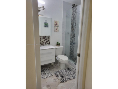 Seller motivated. All remodeled 2 bedrooms and 2 baths unit on Country Club of Miami in Florida - for sale on GolfHomes.com, golf home, golf lot