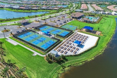 Experience the pinnacle of lakefront living in the heart of on Sarasota National Golf Club in Florida - for sale on GolfHomes.com, golf home, golf lot