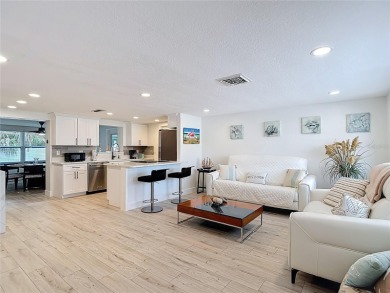 Live the Florida lifestyle in the highly sought-after waterfront on Gulf Harbors Golf Course in Florida - for sale on GolfHomes.com, golf home, golf lot