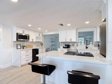 Live the Florida lifestyle in the highly sought-after waterfront on Gulf Harbors Golf Course in Florida - for sale on GolfHomes.com, golf home, golf lot