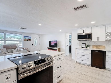 Live the Florida lifestyle in the highly sought-after waterfront on Gulf Harbors Golf Course in Florida - for sale on GolfHomes.com, golf home, golf lot